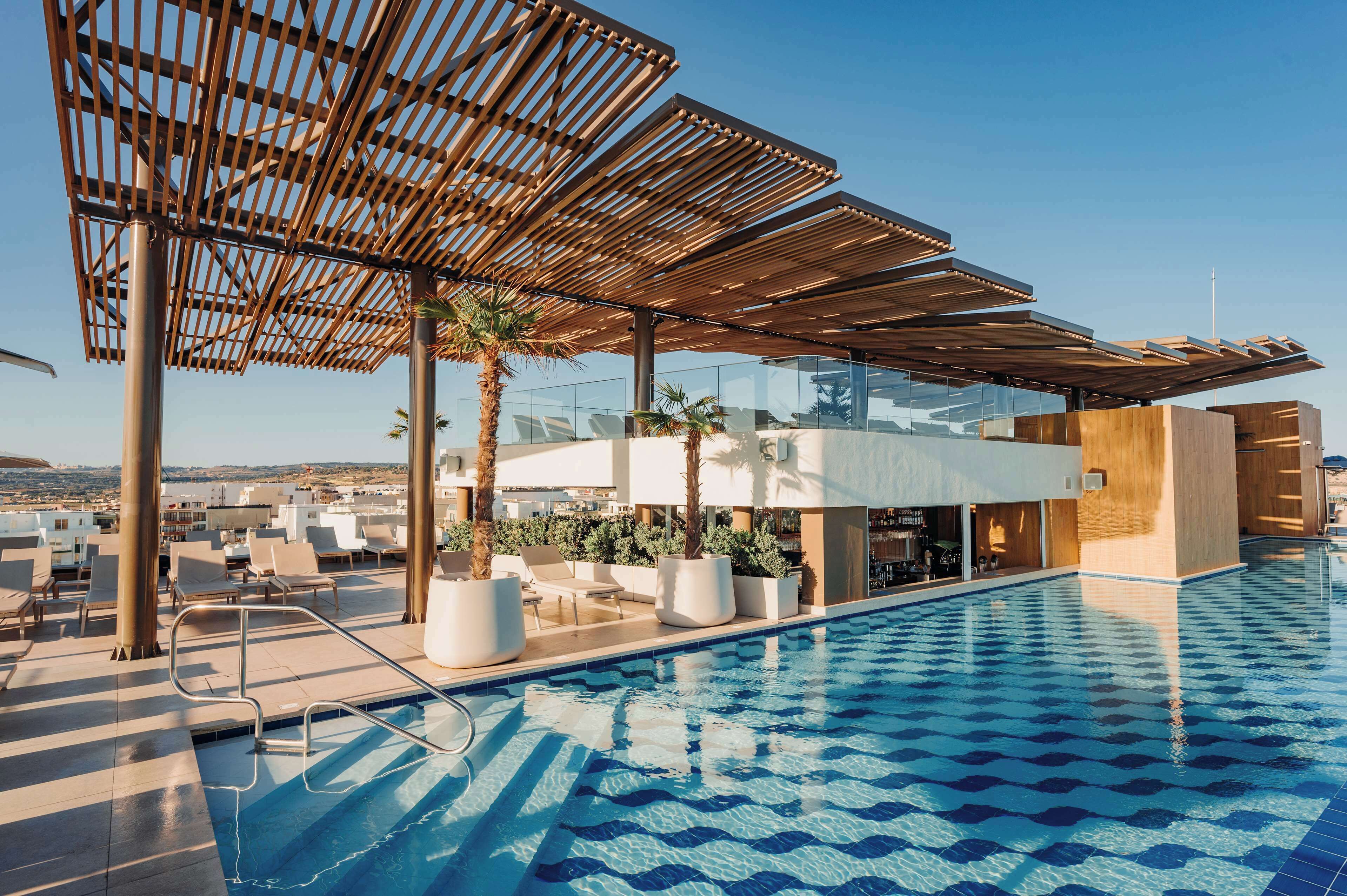 Indoor pool, outdoor pool, pool umbrellas, sun loungers