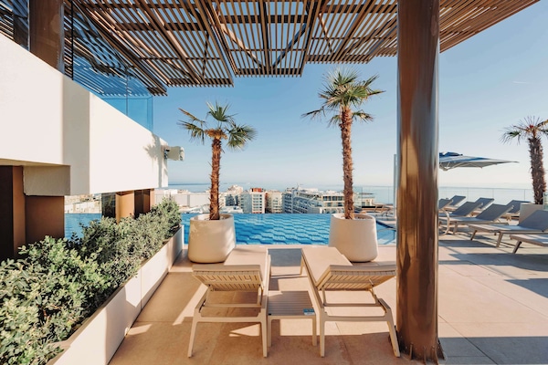 Indoor pool, outdoor pool, pool umbrellas, sun loungers
