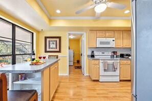 Adorned with sleek countertops, modern appliances, and ample storage, our kitchen offers everything you need to create culinary masterpieces with ease. - Stunning Home w/ Heated Saltwater Pool & Pond View + 12 Guests + Great Location (Temple Terrace)