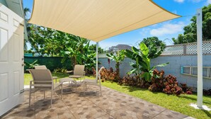 A patio with a tiled floor, outdoor furniture, and a large canopy. - Dreamers Getaway - Relaxing unit with large rooms, full kitchen, & fast Wi-Fi (Nassau)