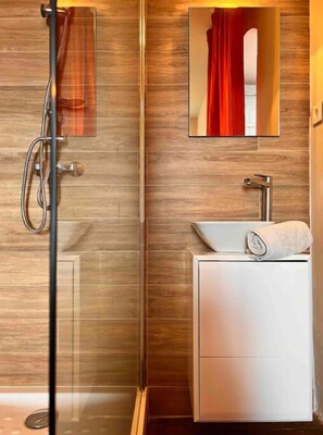 Shower, hair dryer, towels, soap