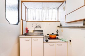 Fridge, microwave, stovetop, cookware/dishes/utensils
