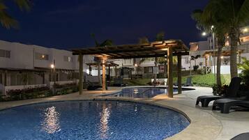 Outdoor pool, open 8:00 AM to 9:00 PM, free cabanas, pool umbrellas