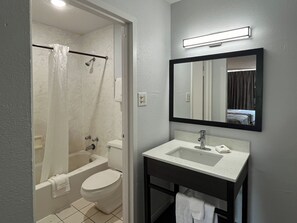 Bathtub, towels, soap, shampoo