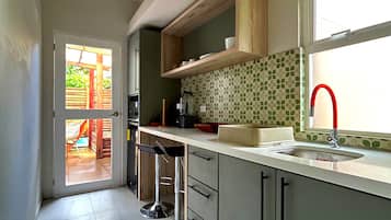 Premium Suite | Private kitchen | Fridge, microwave, coffee/tea maker, eco-friendly cleaning products