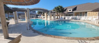 Spacious condo sleeps 6, has 2 pools, a playground and is close to the beach.