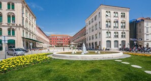 A square with historic buildings, a fountain, and a flower bed. - Luxury Room Ana 2 in the Heart of Split (Split)