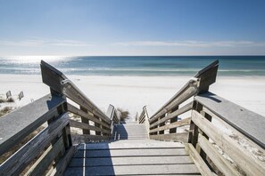 A wooden staircase leading to a beach with a clear view of the ocean. - 30A Private Pool Cottage with Pool and Golf Cart! (Santa Rosa Beach)