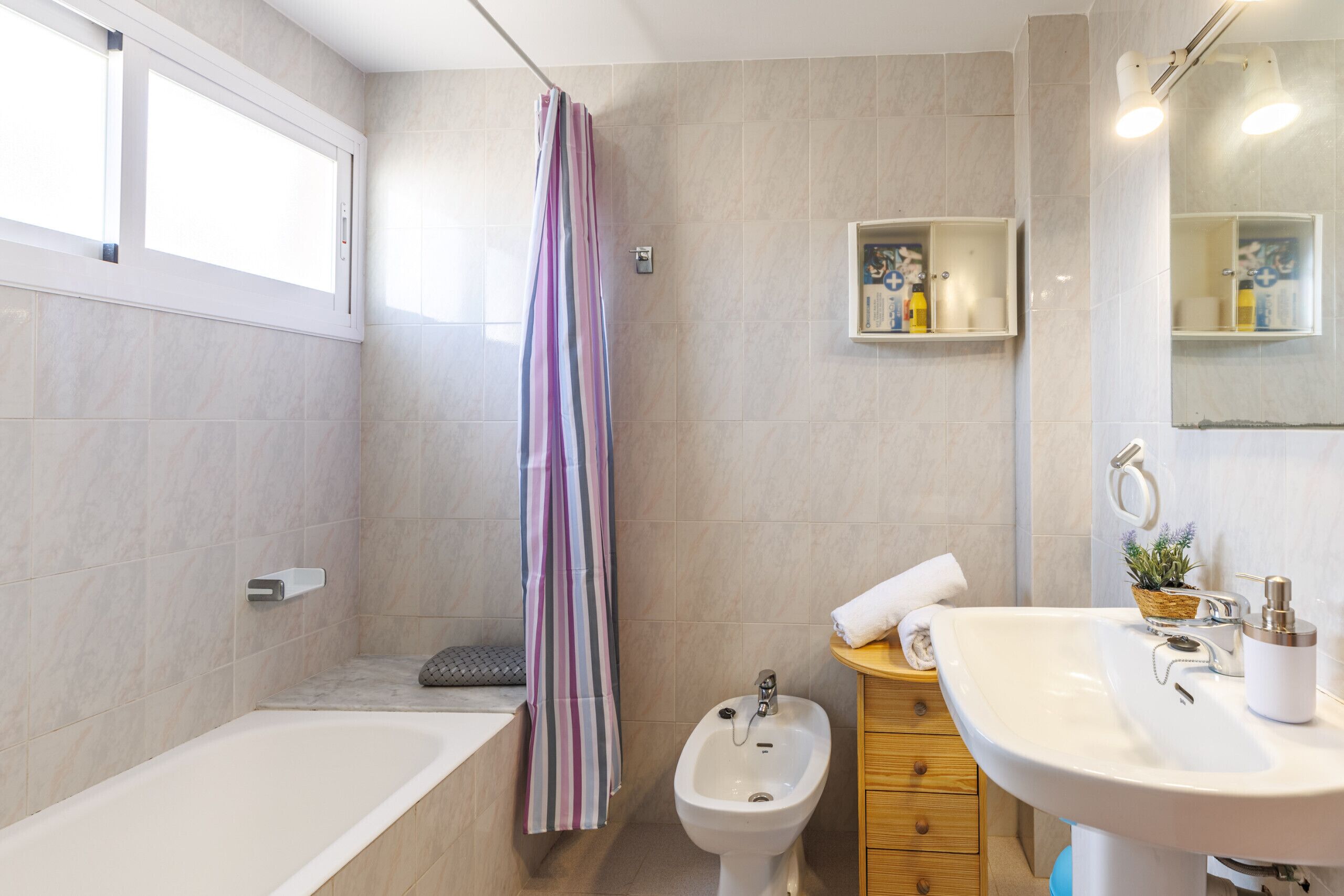 Shower, hair dryer, towels, toilet paper