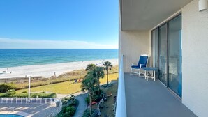 A balcony with a view of the beach and ocean. - BEACHFRONT, TWO POOLS, PRIVATE BALCONY! (Orange Beach)