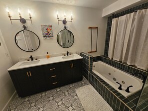Shower, jetted tub, towels, soap
