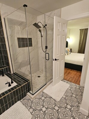 Shower, jetted tub, towels, soap