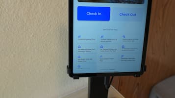 A tablet displaying a travel booking interface with options for guided tours and activities.