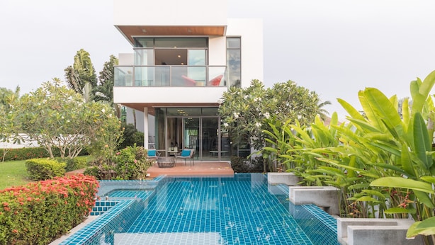 A modern two-story house with a swimming pool in the foreground. - Phuket Cleanse (Rawai)
