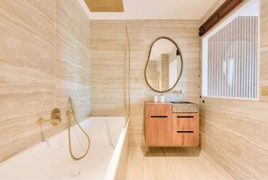 Shower, hair dryer, towels, shampoo