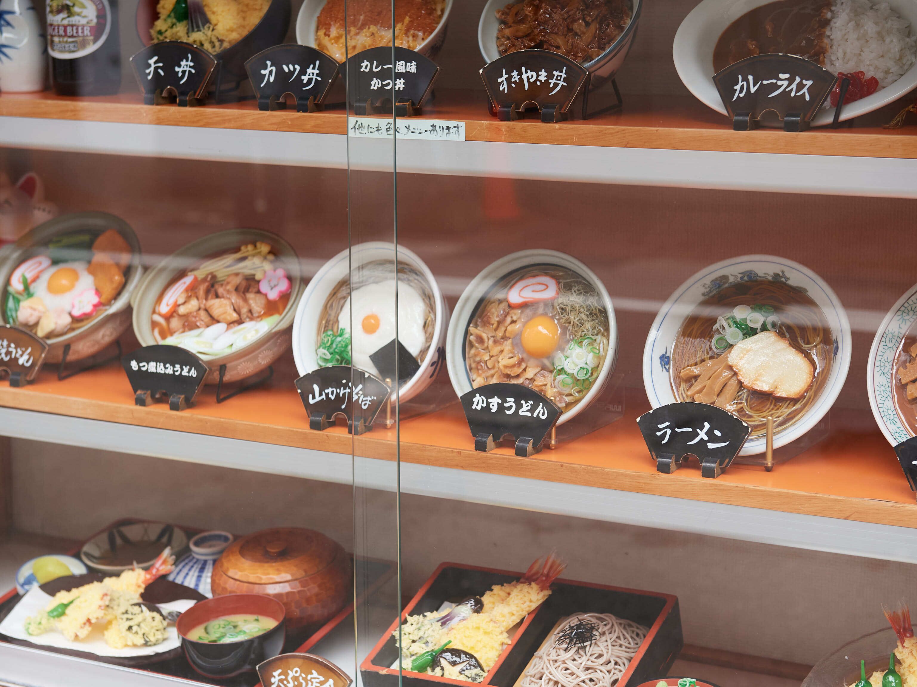 A variety of Japanese dishes displayed in a restaurant setting.