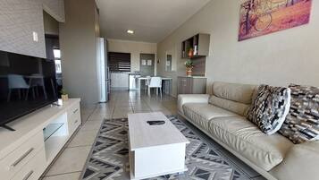 Family Apartment | Living area | 45-inch Smart TV with satellite channels, Netflix, streaming services