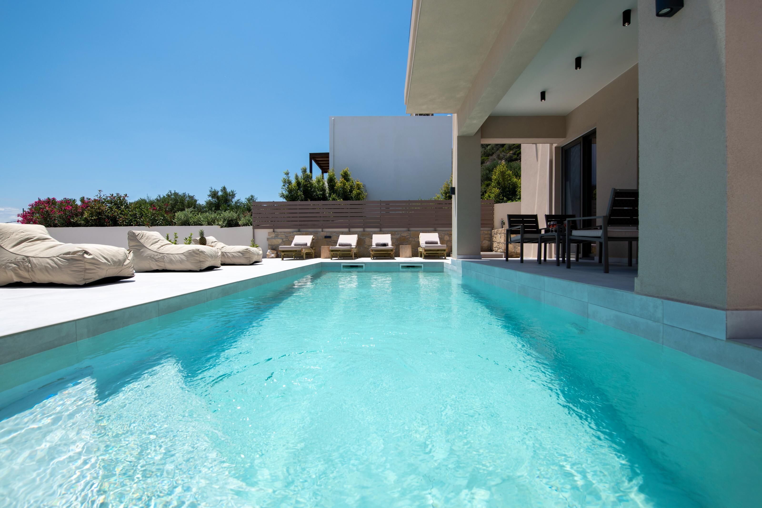 Seasonal outdoor pool, pool loungers