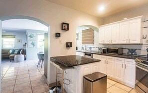 Fridge, microwave, oven, stovetop - Surfers Cove – 3BR/2BA Pool Home Near Calle Ocho (Miami)