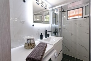 Shower, hair dryer, towels, soap