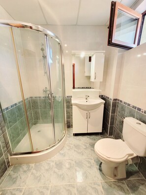 Shower, towels, soap, toilet paper