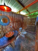 Deluxe Bungalow | Bathroom | Shower, towels, soap, toilet paper