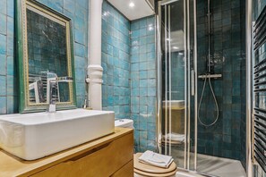 Shower, hair dryer, towels, soap