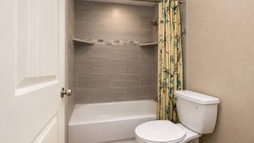 Shower, hair dryer, towels, shampoo