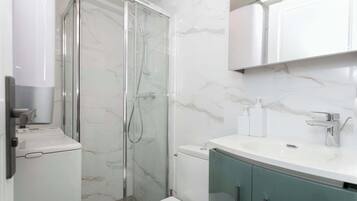 Shower, hair dryer, towels, soap