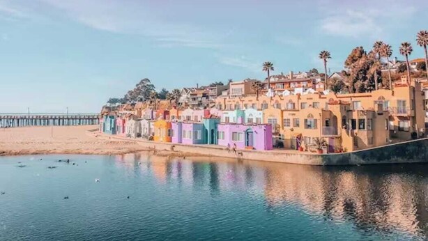 A coastal town with colorful buildings along the waterfront.