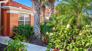 A building with a red-tiled roof, a window with a white frame, and a sign with the number 650. - ⭐⭐5 Bed, 4 Bath Property | SOUTH Facing Pool | Gated Resort | Mins to Disney ⭐⭐ (Davenport)