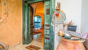 A doorway leading to a room with a view, a dreamcatcher, and a welcome mat. - Loveneel Sea Galilee Retreat by SeaNRent (Yavne'el)