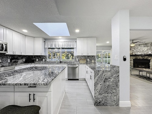 Four Beds, three baths, heated pool, and a Golf Course. What more do you need!!