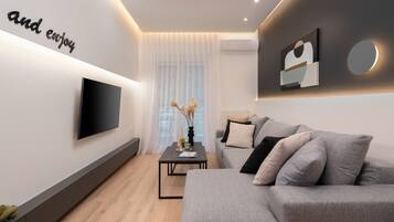 Exclusive Apartment | Living area | 55-inch Smart TV with cable channels