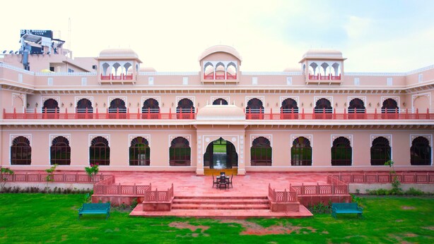 A large, multi-story building with a central courtyard, featuring a series of arches and balconies. - BR Resort & Club (Sonkach)