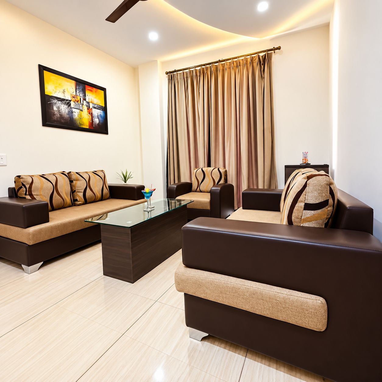 A modern living room with a sofa set, a glass coffee table, and a painting on the wall.