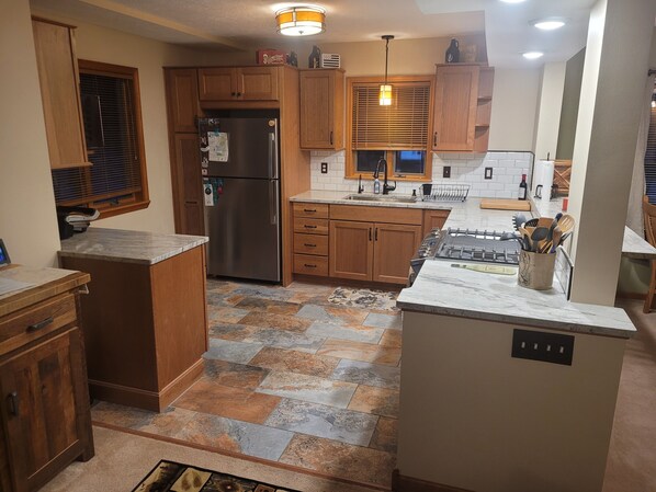 Fridge, microwave, oven, stovetop - Multi-week rental directly on Chandler Lake  deck, fire pit, tandem kayak. (Traverse City)