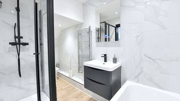 Shower, hair dryer, towels, soap