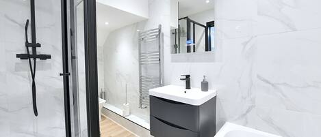 Shower, hair dryer, towels, soap