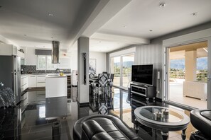 Superior Apartment, Terrace, Sea View | Living area | Flat-screen TV