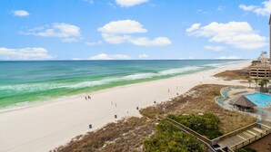 A beach resort with a swimming pool, beach access, and a view of the ocean. - FREE Beach Service & Perks! Emerald Beach 732 Pool, Hot Tub, Starbucks, Gym! (Panama City Beach)