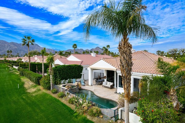 A residential property with a swimming pool, patio, and views of mountains. - Incredible Views From This 4 Bedroom Pool Home With Office and Sofa Sleeper (La Quinta)