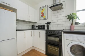 Apartament clàssic, no fumadors | Cuina privada | Placa de cuina i bullidora elèctrica