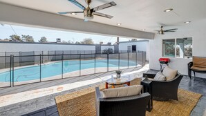 A covered outdoor area with a swimming pool, seating, and ceiling fans. - 2 Mi to Golf: Poolside Paradise in Scottsdale! (Scottsdale)