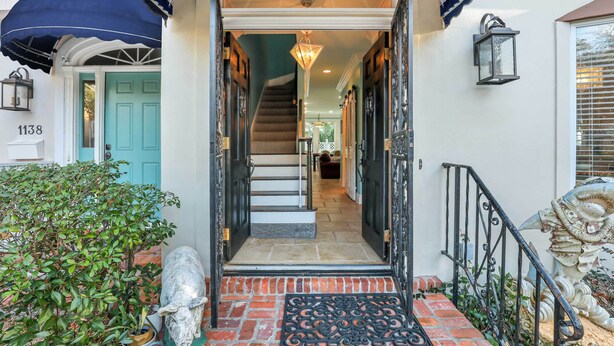 A staircase leading to a second floor with a blue door and a number 1138 on the wall. - St Simons Island Townhome w/ Balcony + Ocean View! (St. Simons Island)