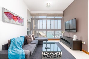 Panoramic Apartment | Living area | 55-inch Smart TV with digital channels - Vacay Lettings - Iris Blue (Dubai)