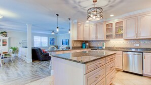 A spacious kitchen with a large island, light wood cabinets, and stainless steel appliances. - 🌴3 Palms- 3BD Handicap Accessible Home w/ Pool!🌴 (Carolina Beach)