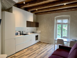 Duplex | Private kitchen | Full-size fridge, microwave, stovetop, dishwasher - ALBOLA SUITE Holiday Apartments (Riva del Garda)