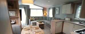 A compact kitchen with an adjoining lounge area. - 8 Guests - 3 Bedrooms - Pet Friendly - Lakeview (Windermere)