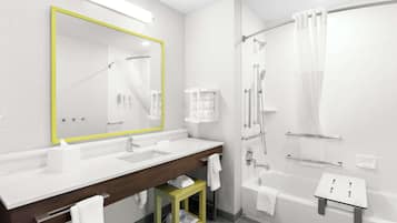 A modern bathroom with a large mirror, a sink, a shower, and a small stool.